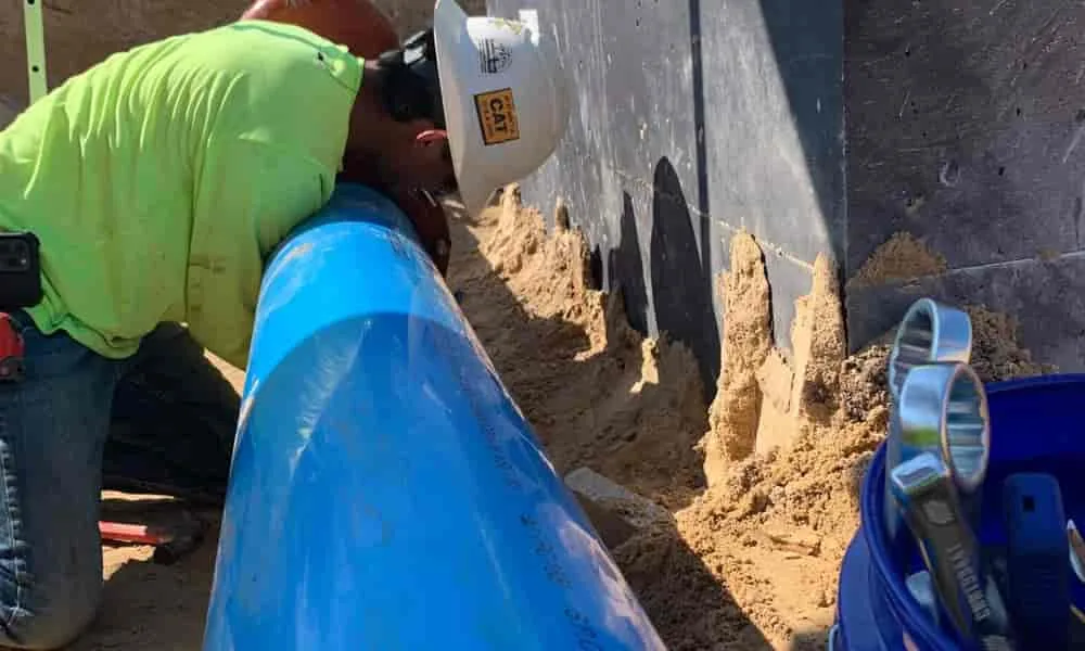 Pipe being laid in an open trench