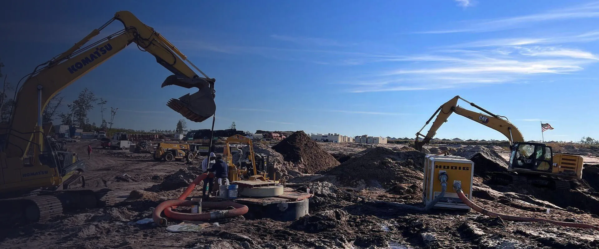 Excavators and crew on a utility job