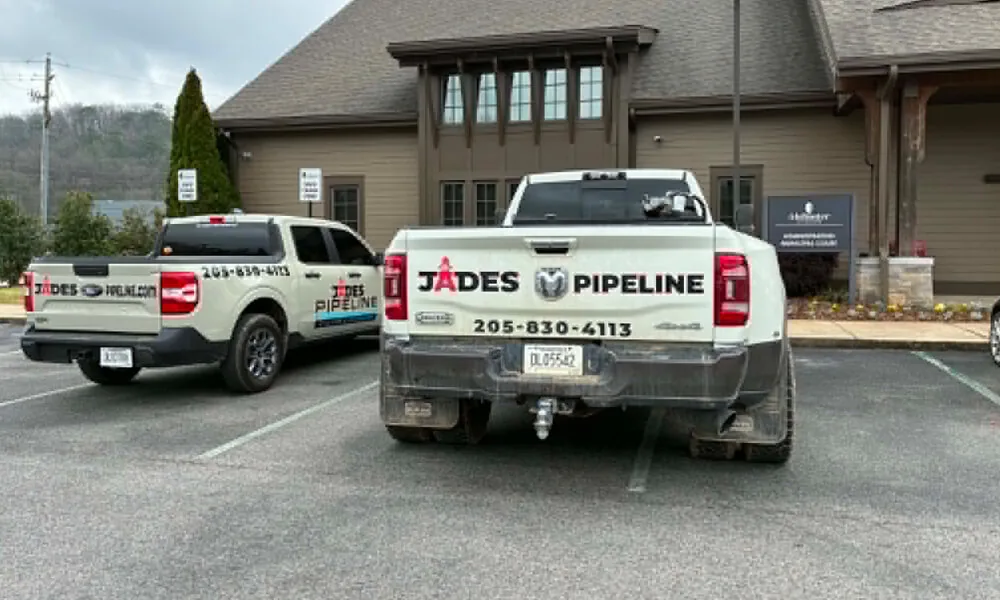 Jades Pipeline trucks on a job site